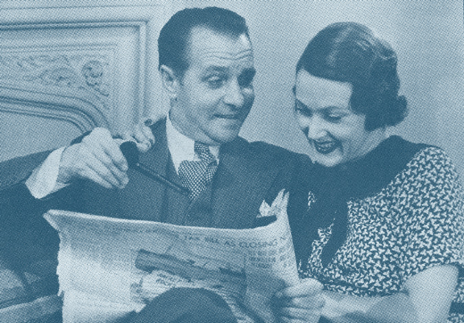 Man en vrouw lezen geamuseerd de krant